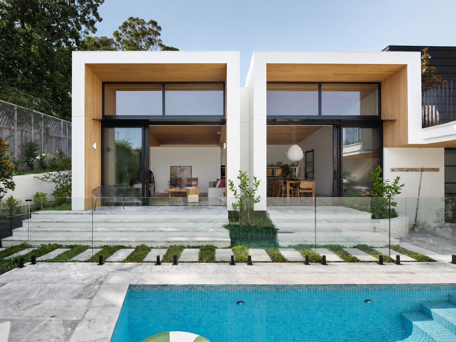 Canvas House pool courtyard with glass fencing and integrated garden
